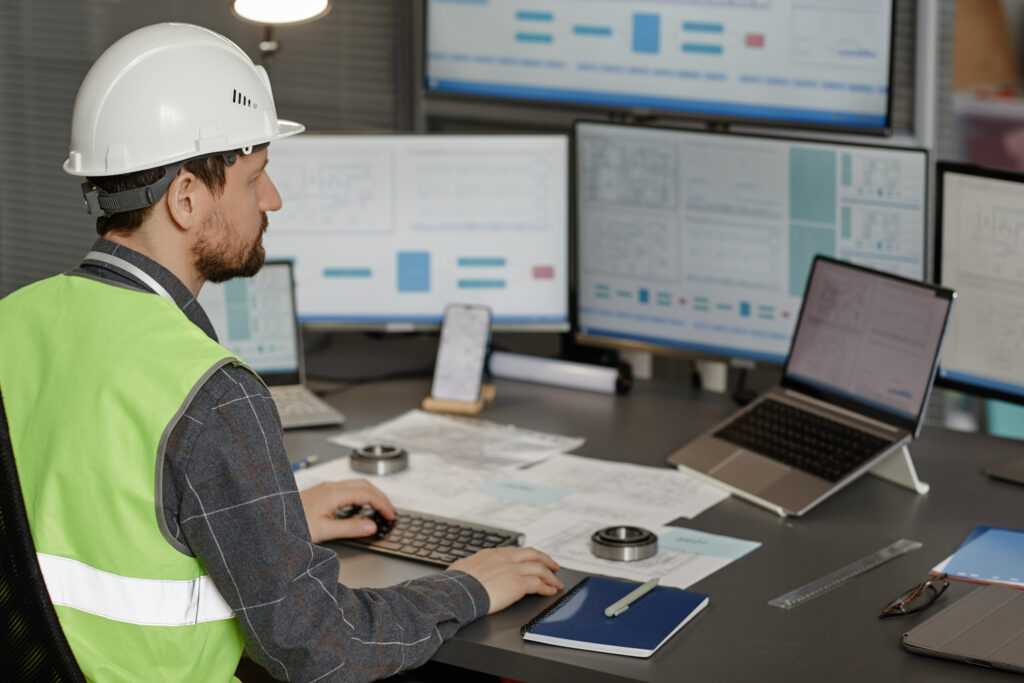 man using a safety incident reporting software on a computer