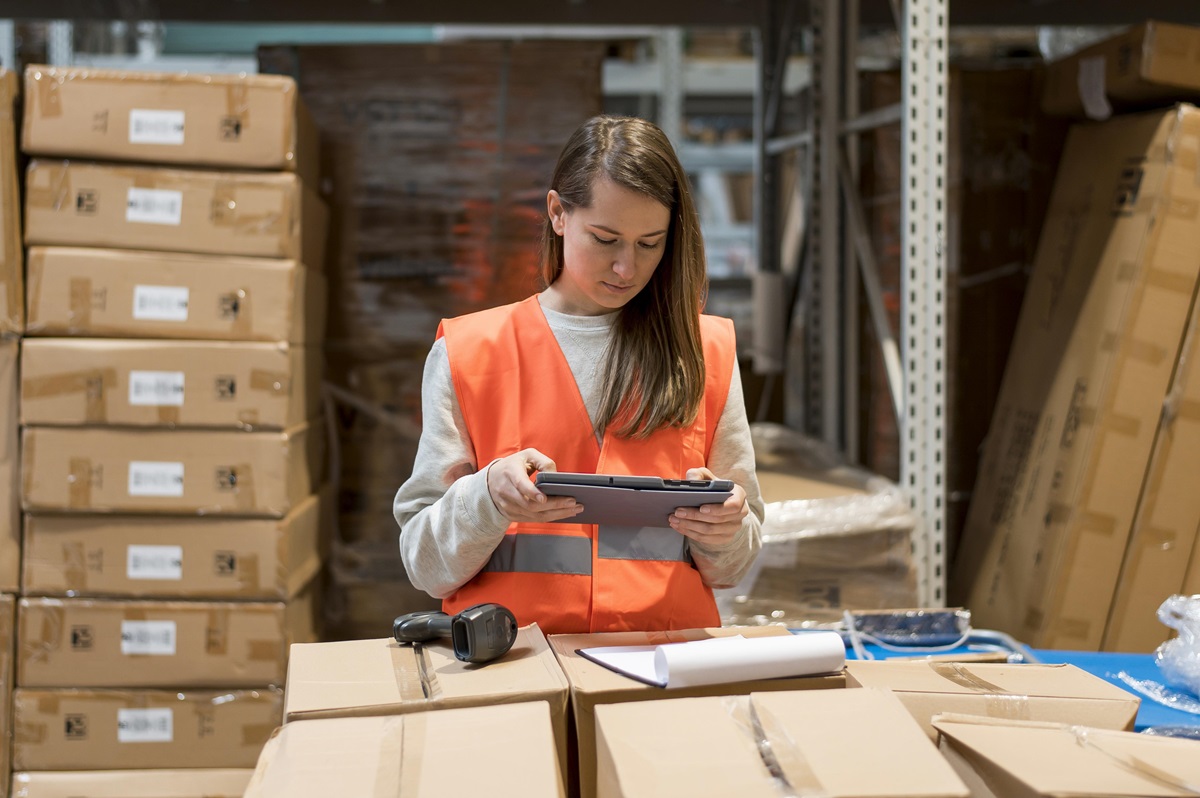 Businesswoman using warehouse safety software