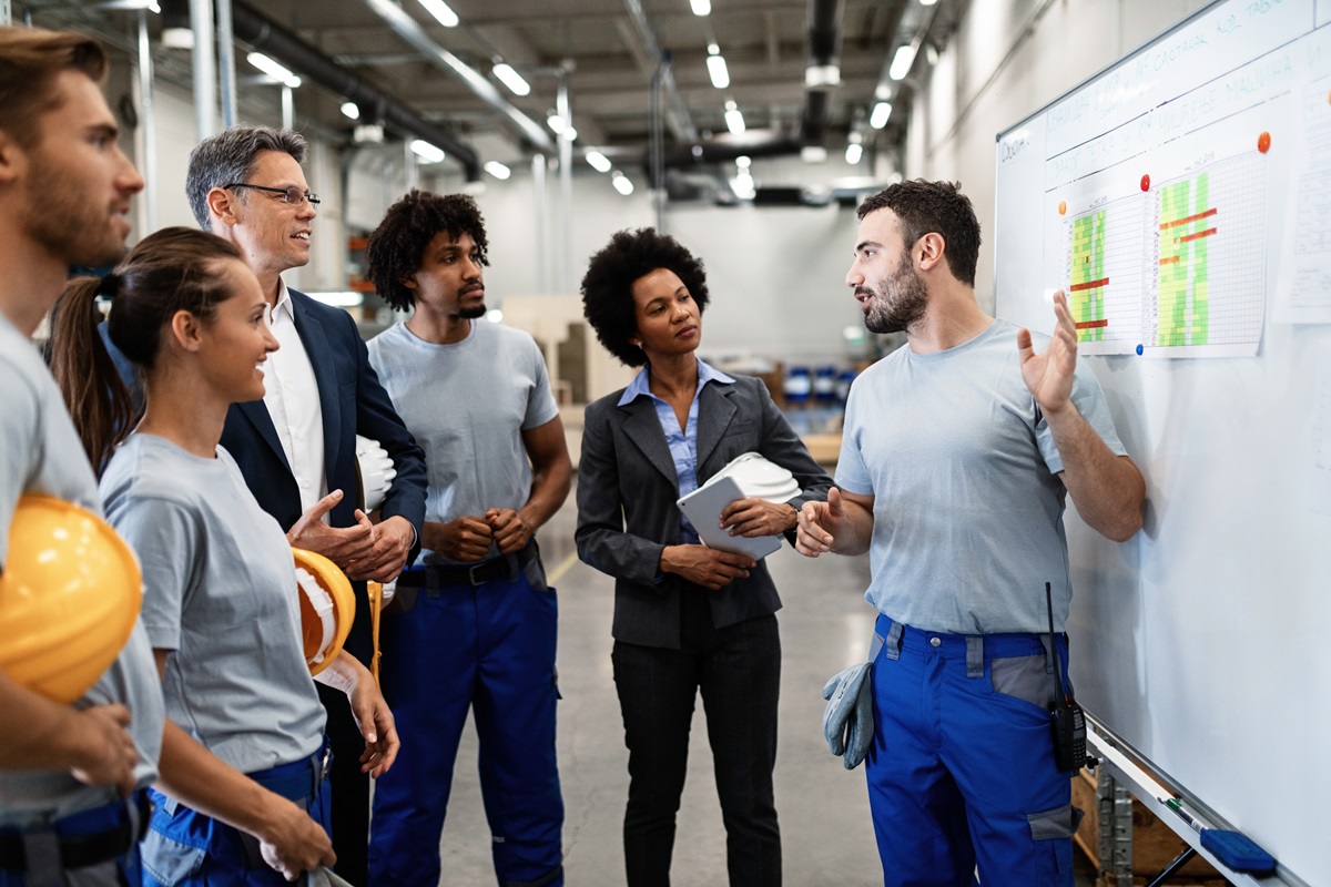 Man conducting EHS training with colleagues