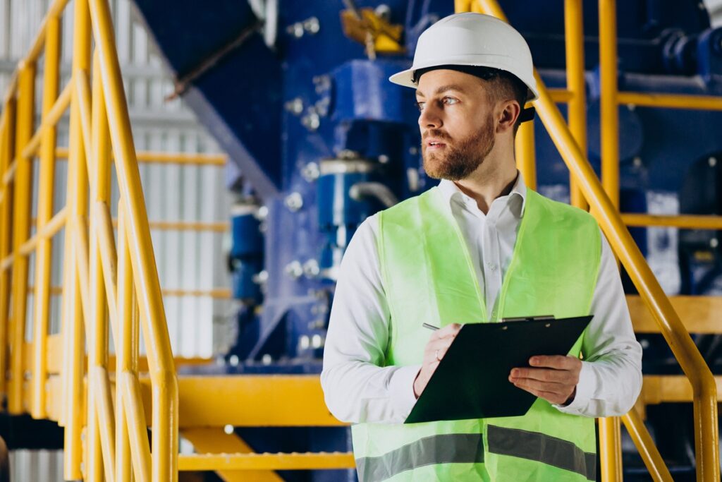 Worker using an OSHA compliance checklist