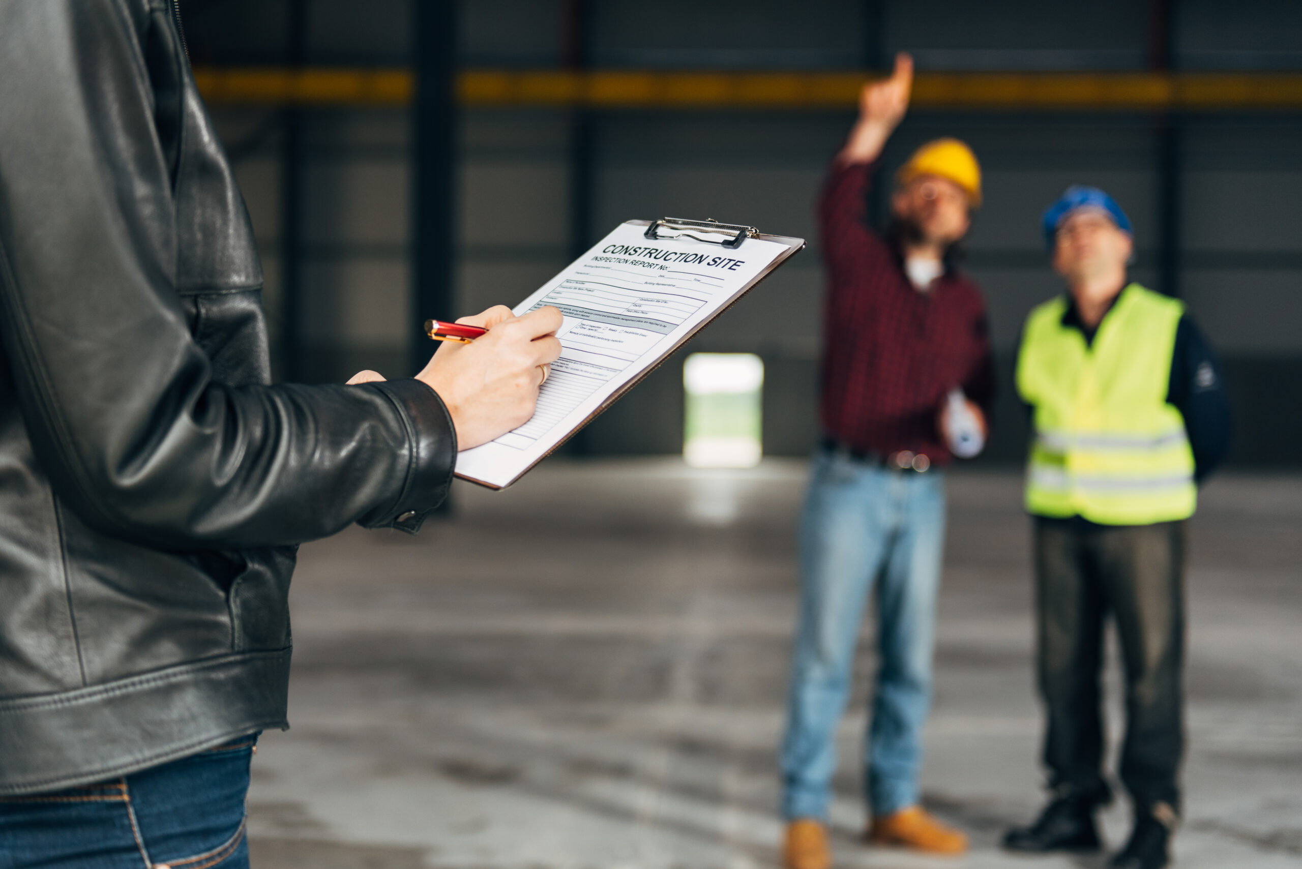 Construction Site Inspector making report