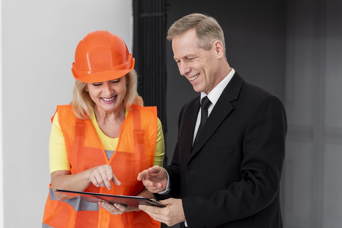 Business colleagues following an EHS compliance checklist