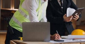 Construction team using contractor management software to track compliance data